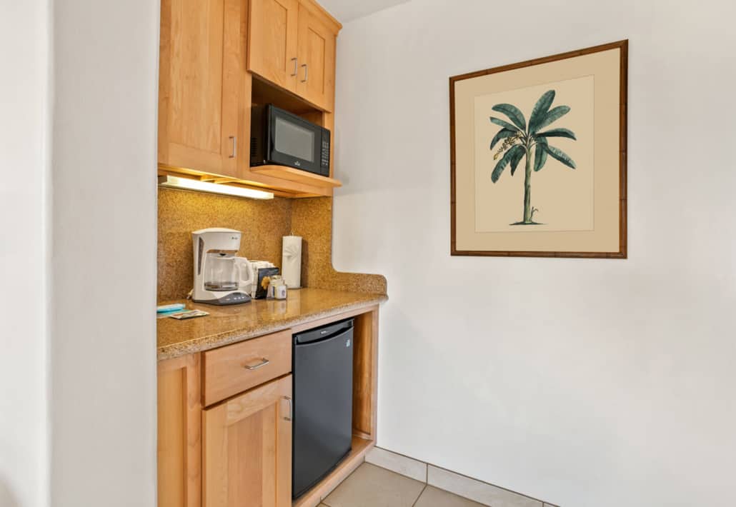 counter top appliances with a mini refrige and a microwave