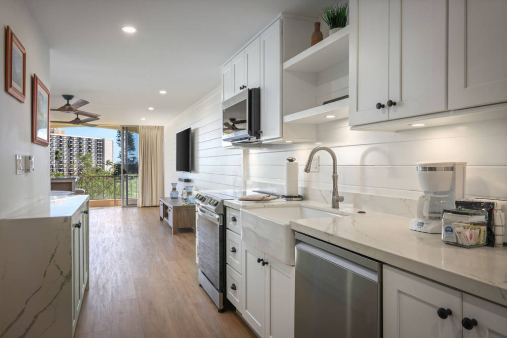 view from the kitchen with f full stove, microwave, dishwasher and counter top appliances