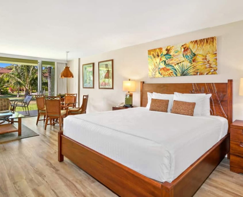 studio room with bed and seperate dining and outdoor covered lanai