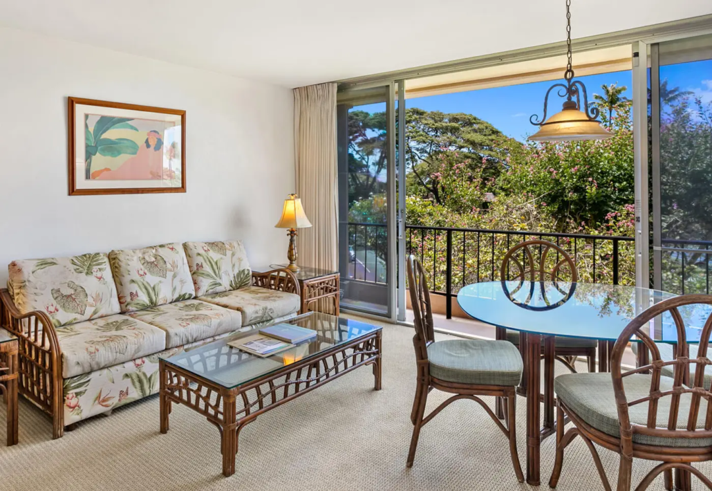 living room seating with coffee table and a seperate dining area for four