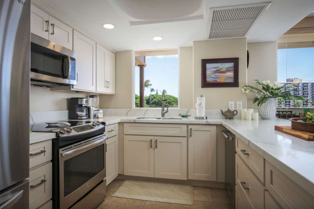 Full kitchen with a stove and oven, microwave, refrigerator, and dish washer