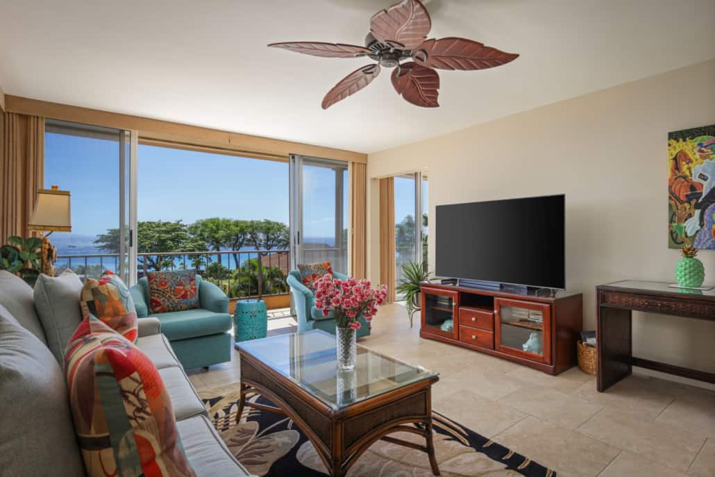 Spacious living room with separate seating and television with a lanai