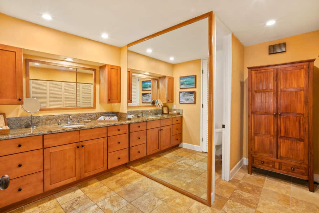 Bathroom with large mirrors and basin