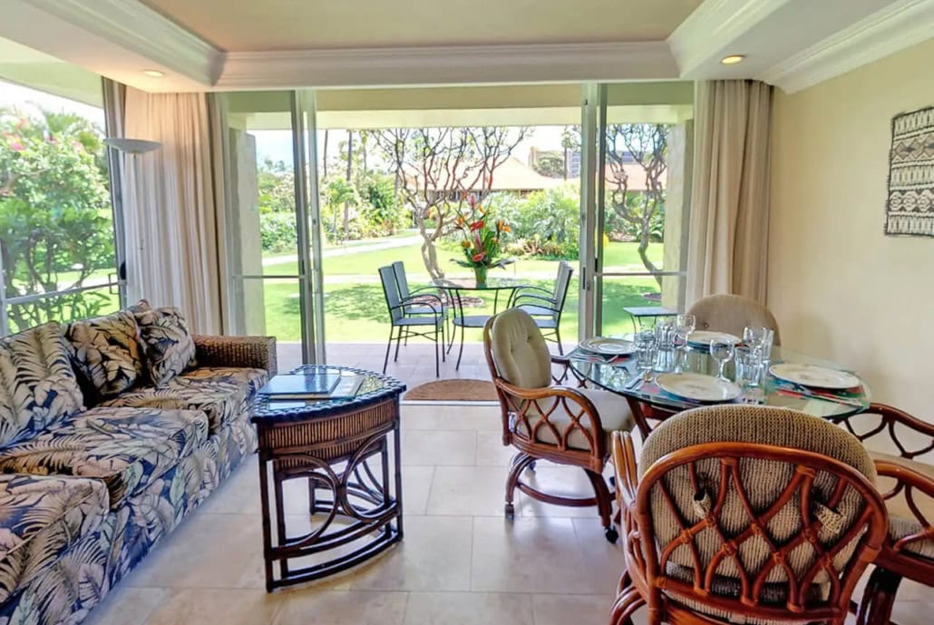 light and airy living room with separate seating and outdoor private lanai
