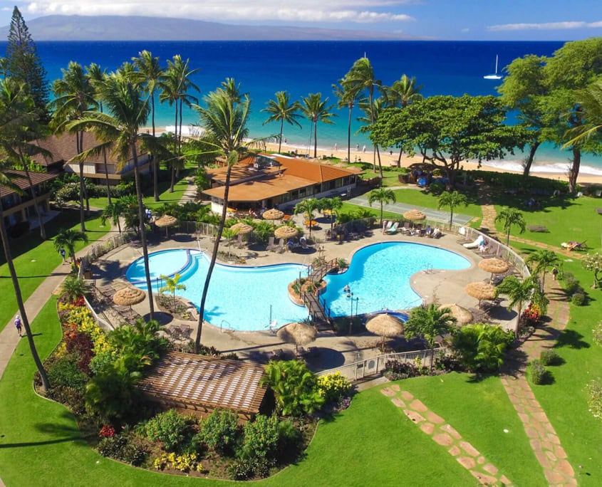 Aerial view of resort pool and beachfront.
